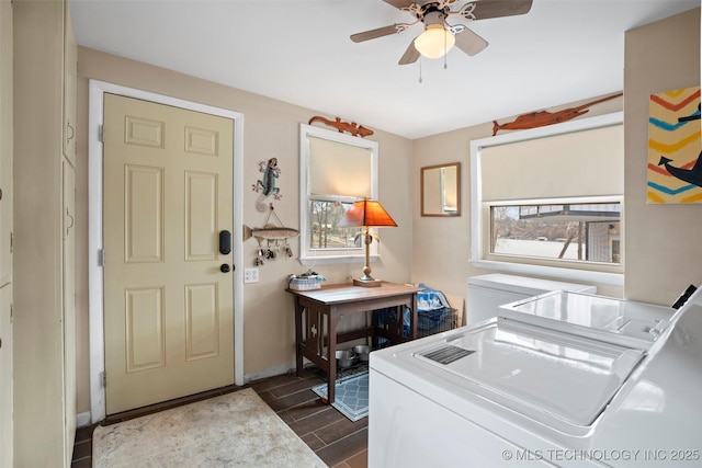 clothes washing area with washing machine and clothes dryer and ceiling fan