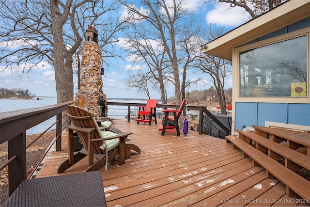 wooden deck featuring a water view