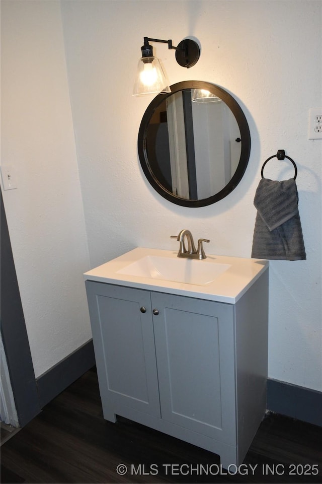 bathroom featuring vanity and hardwood / wood-style flooring