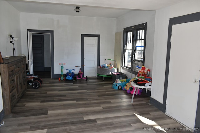 recreation room with dark hardwood / wood-style flooring