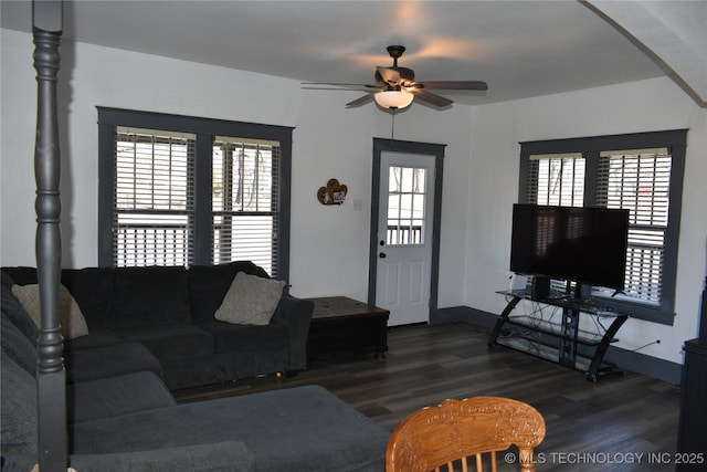 living room with ceiling fan, dark hardwood / wood-style flooring, and a wealth of natural light