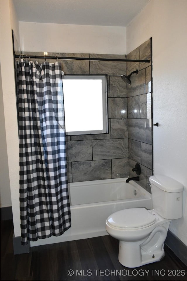 bathroom with shower / bath combination with curtain, wood-type flooring, and toilet