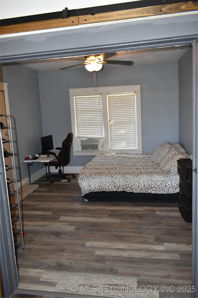 bedroom with dark wood-type flooring