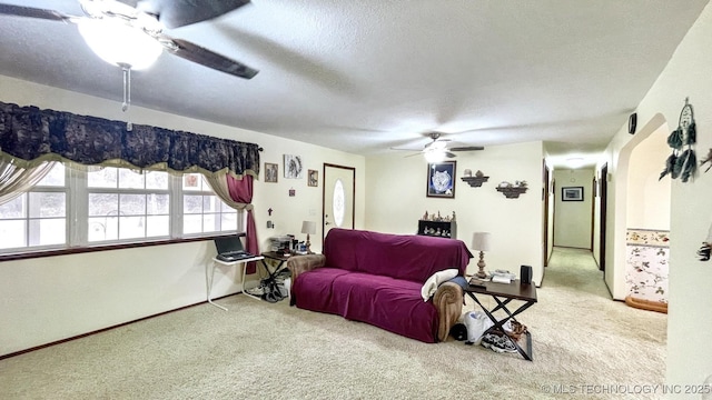 96848 S 4510th Rd, Vian, OK 74962 - carpeted living room with a ceiling fan, a textured ceiling, and baseboards