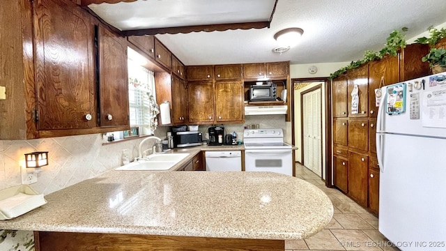 96848 S 4510th Rd, Vian, OK 74962 - kitchen featuring white appliances, a sink, under cabinet range hood, light countertops, and decorative backsplash