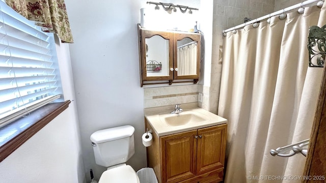 96848 S 4510th Rd, Vian, OK 74962 - bathroom featuring vanity, toilet, decorative backsplash, and a shower with shower curtain