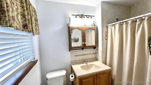96848 S 4510th Rd, Vian, OK 74962 - full bath featuring vanity, a shower with curtain, toilet, and decorative backsplash