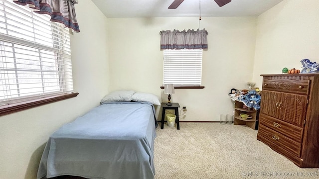 96848 S 4510th Rd, Vian, OK 74962 - carpeted bedroom with multiple windows, a ceiling fan, and baseboards