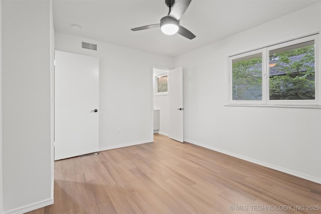501 W 17th St, Pawhuska, OK 74056 - unfurnished bedroom featuring light wood finished floors, baseboards, and a ceiling fan