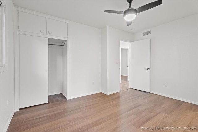 501 W 17th St, Pawhuska, OK 74056 - unfurnished bedroom with light wood-type flooring, baseboards, a ceiling fan, and a closet