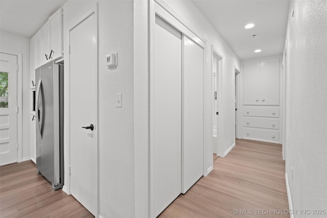 501 W 17th St, Pawhuska, OK 74056 - hall featuring light wood-type flooring, recessed lighting, and baseboards