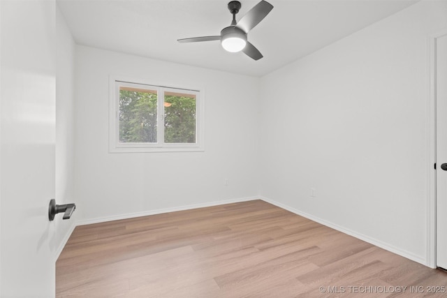 501 W 17th St, Pawhuska, OK 74056 - empty room featuring light wood-style floors, ceiling fan, and baseboards