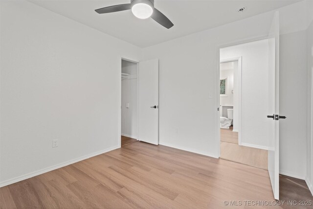 501 W 17th St, Pawhuska, OK 74056 - unfurnished bedroom with light wood-style floors, a closet, baseboards, and ceiling fan
