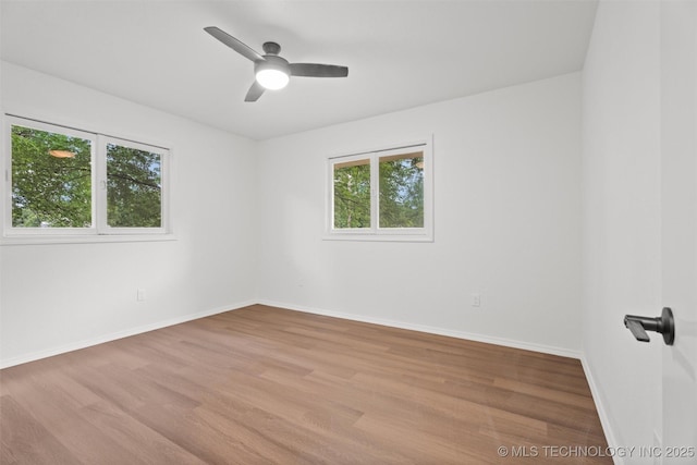 501 W 17th St, Pawhuska, OK 74056 - spare room with wood finished floors, baseboards, and a ceiling fan