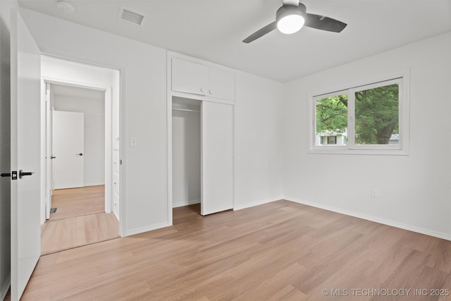 501 W 17th St, Pawhuska, OK 74056 - unfurnished bedroom with light wood-style flooring, baseboards, a closet, and ceiling fan