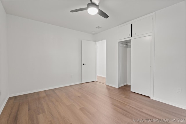 501 W 17th St, Pawhuska, OK 74056 - unfurnished bedroom with light wood-type flooring, a closet, baseboards, and ceiling fan