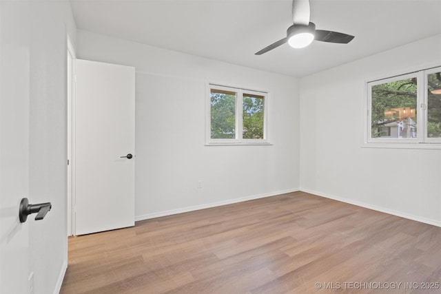 501 W 17th St, Pawhuska, OK 74056 - unfurnished room featuring healthy amount of natural light, light wood-type flooring, and ceiling fan