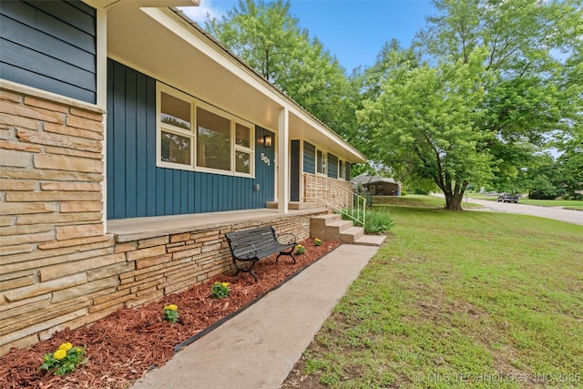 501 W 17th St, Pawhuska, OK 74056 - view of side of property with a yard and covered porch