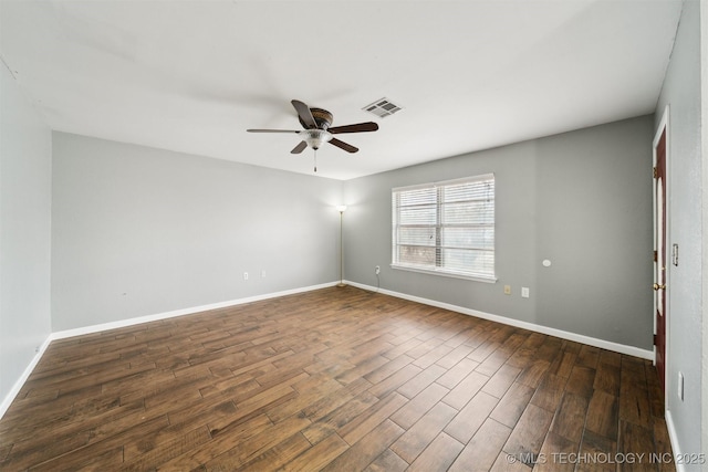 unfurnished room with dark hardwood / wood-style floors and ceiling fan