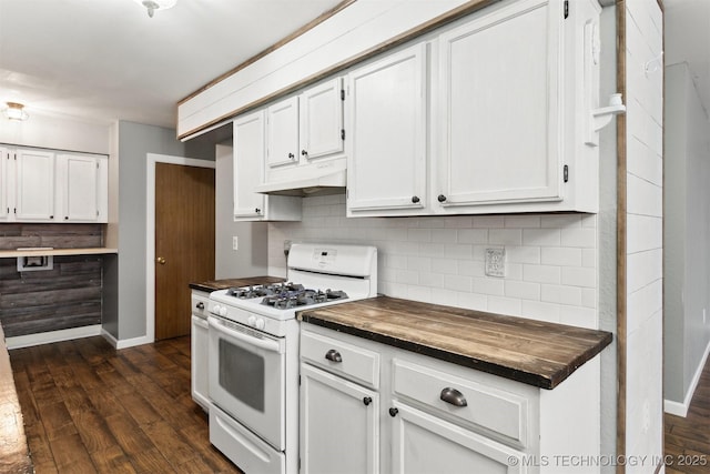 kitchen with dark wood-type flooring, butcher block counters, white cabinets, decorative backsplash, and white gas stove