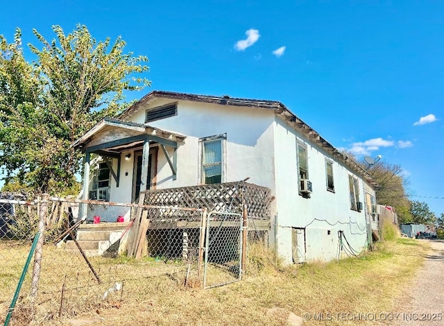 view of front of house featuring cooling unit