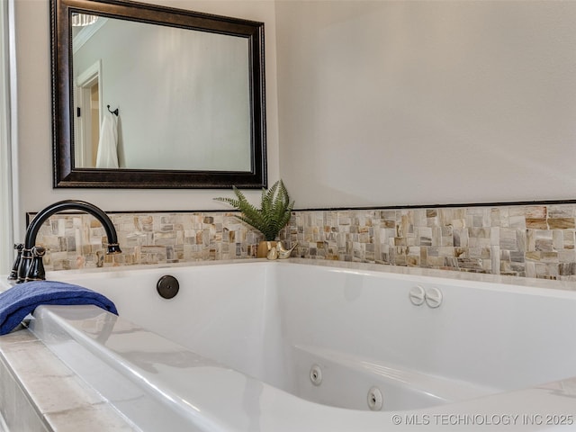 bathroom featuring tiled bath