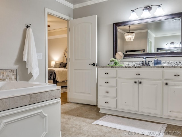 bathroom with ornamental molding, vanity, and tile patterned floors