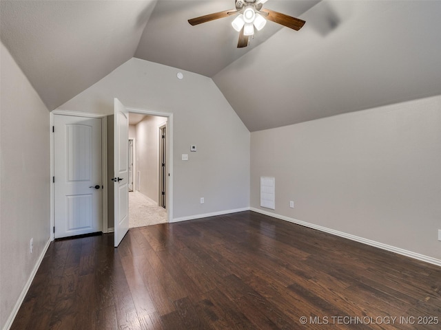 bonus room with lofted ceiling, dark hardwood / wood-style floors, and ceiling fan