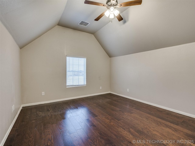 bonus room with dark wood-type flooring, ceiling fan, and vaulted ceiling