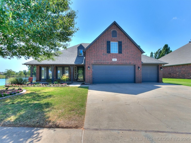 view of front of property with a garage and a front yard