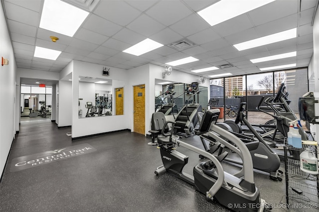 workout area featuring a paneled ceiling