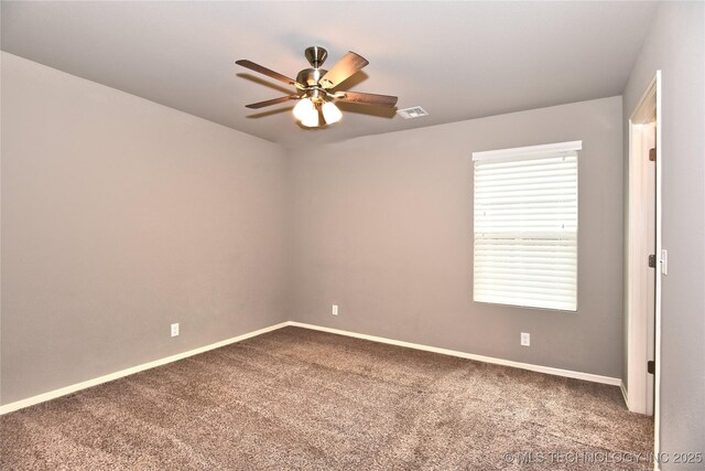 empty room with carpet floors and ceiling fan