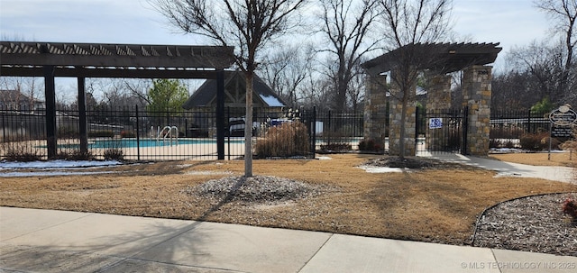 surrounding community featuring a swimming pool and a pergola