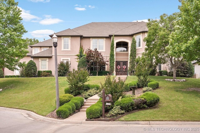 mediterranean / spanish-style home with a front lawn