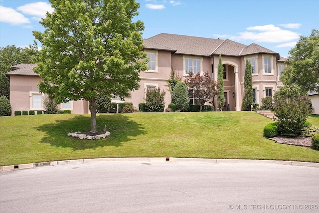 view of front facade with a front lawn