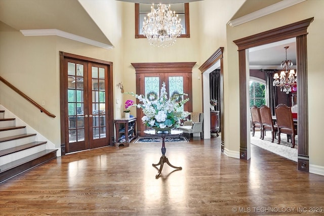 6215 E 86th Pl, Tulsa, OK 74137 - foyer entrance with dark hardwood / wood-style floors, a chandelier, and french doors