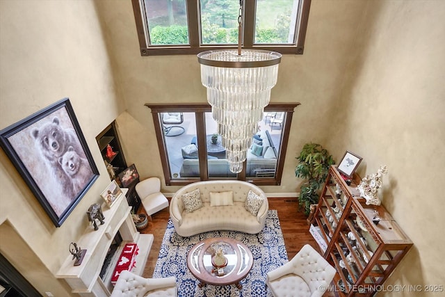 6215 E 86th Pl, Tulsa, OK 74137 - living area featuring a high ceiling, dark wood-type flooring, and a chandelier