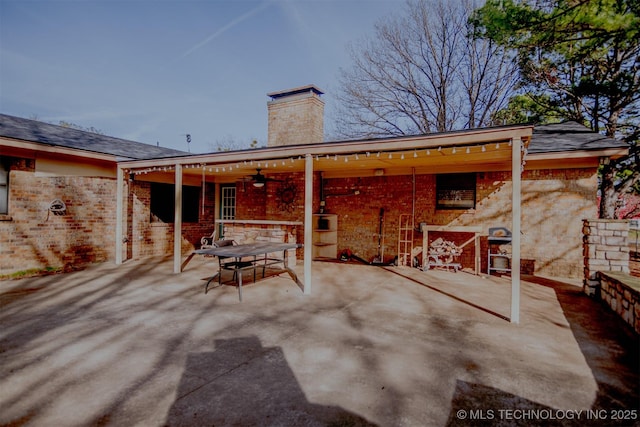 exterior space with ceiling fan