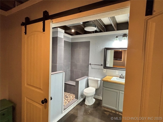 bathroom with vanity, concrete floors, toilet, and walk in shower