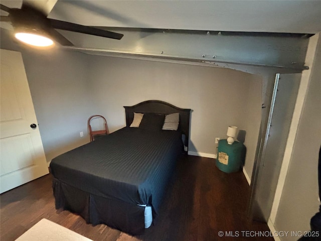 bedroom featuring ceiling fan and dark hardwood / wood-style flooring