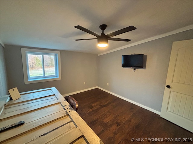 interior space featuring lofted ceiling, dark wood-type flooring, and ceiling fan