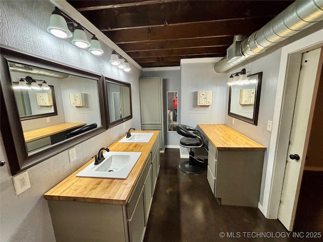 bathroom with sink and concrete floors