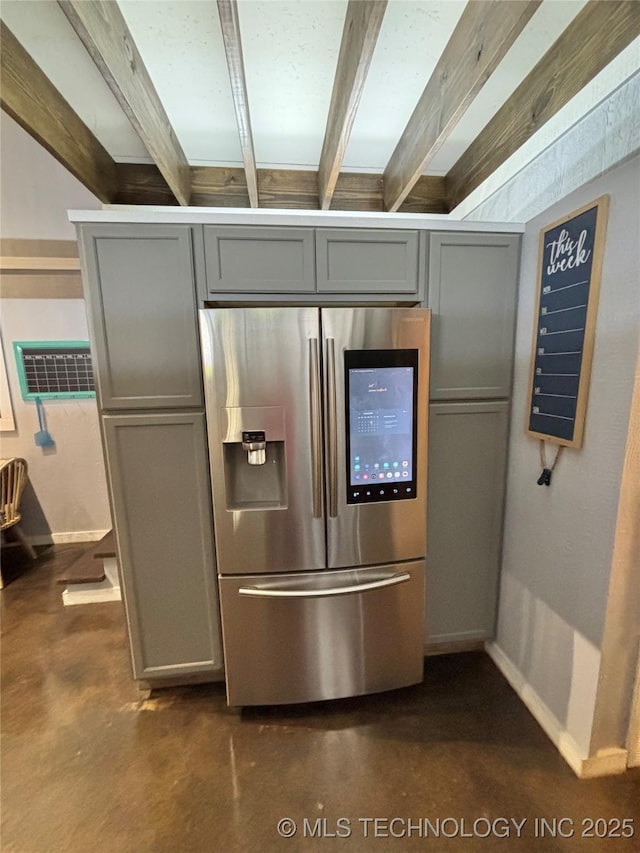 kitchen with stainless steel refrigerator with ice dispenser, beam ceiling, and gray cabinets