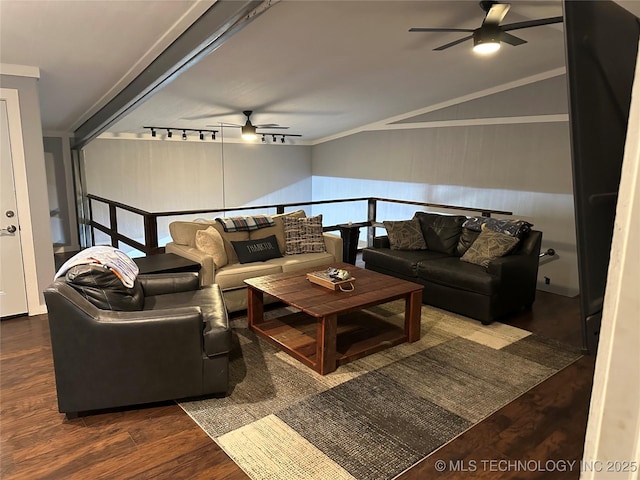 living room with lofted ceiling, track lighting, ornamental molding, dark hardwood / wood-style flooring, and ceiling fan