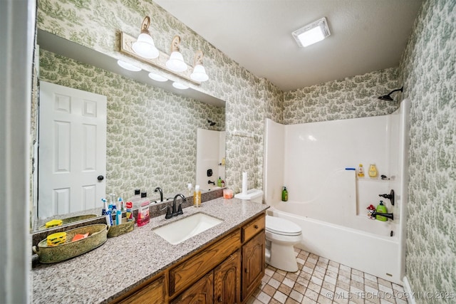 full bathroom featuring vanity, tile patterned floors, toilet, and shower / bath combination