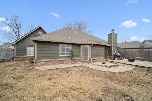 back of property featuring a patio area