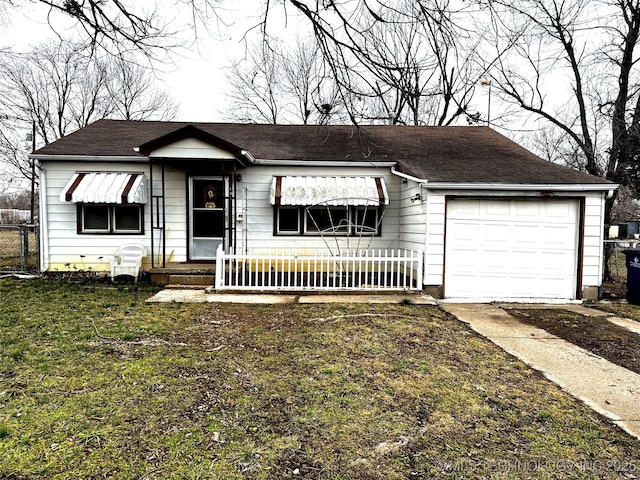 ranch-style house featuring a garage and a front yard