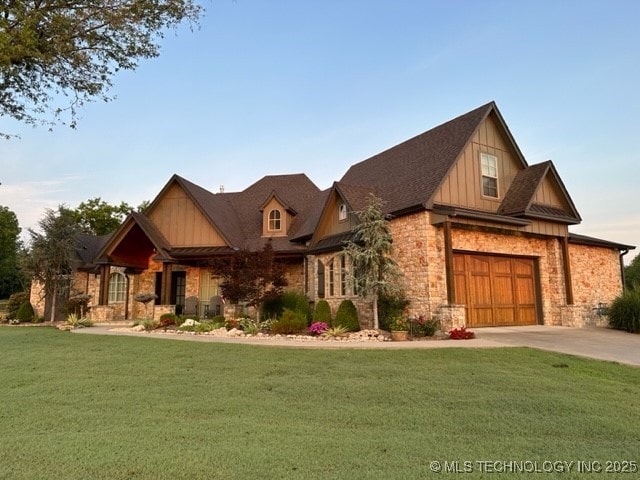 craftsman inspired home with a garage and a front lawn