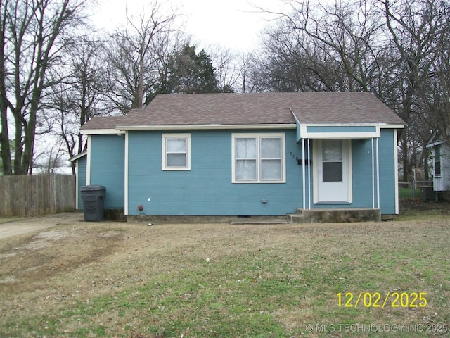 rear view of house with a lawn