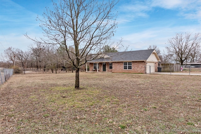 exterior space featuring a garage and a front lawn